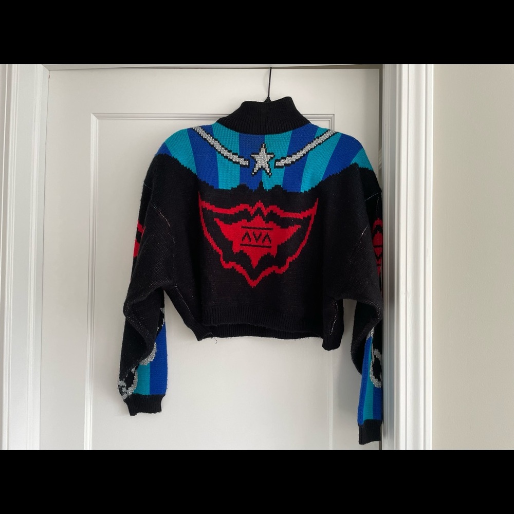 Cropped sweater, design on both front & back with shoulder pads size M